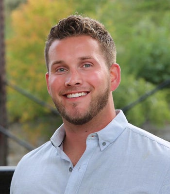 Portrait of Zach Olson,  Urban Realtor.